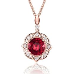 A 14KT ROSE GOLD AND RUBY & DIAMOND PENDANT.