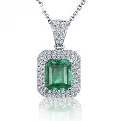 A 18KT WHITE GOLD AND EMERALD & DIAMOND PENDANT.