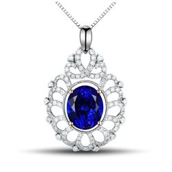 A 14KT TWO-TONE GOLD AND TANZANITE & DIAMONDS PENDANT.