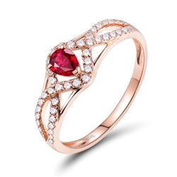 A 14KT ROSE GOLD AND RUBY & DIAMOND RING.