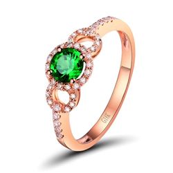 A 18KT ROSE GOLD AND TSAVORITE & DIAMOND RING.