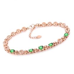 A 18KT ROSE GOLD AND TSAVORITE & DIAMOND BRACELET.