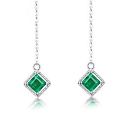 A 18KT WHITE GOLD AND EMERALD EARRINGS.