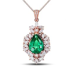 A 18KT ROSE GOLD AND EMERALD & DIAMONDS PENDANT.