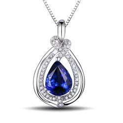 A 18KT WHITE GOLD AND TANZANITE & DIAMONDS PENDANT.