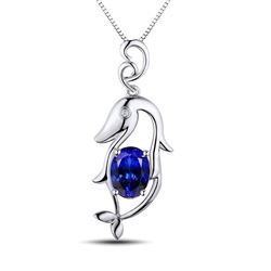 A 18KT WHITE GOLD AND TANZANITE & DIAMONDS PENDANT.
