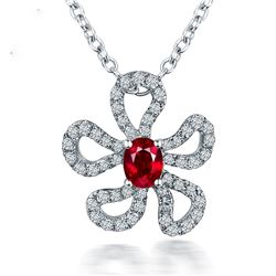 A 14KT WHITE GOLD AND RUBY & DIAMONDS PENDANT.