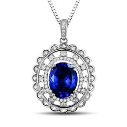 A 14KT WHITE GOLD AND TANZANITE & DIAMONDS PENDANT.