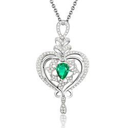 A 18KT WHITE GOLD AND EMERALD & DIAMONDS PENDANT.