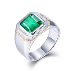 A 18KT WHITE GOLD AND EMERALD & DIAMONDS RING.