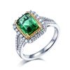 Image 1 : A 18KT WHITE GOLD AND EMERALD & DIAMONDS RING.
