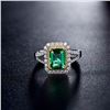 Image 2 : A 18KT WHITE GOLD AND EMERALD & DIAMONDS RING.