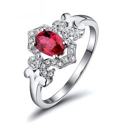A 18KT WHITE GOLD AND RUBY & DIAMONDS RING.