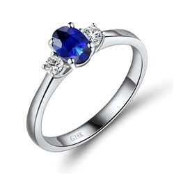 A 18KT WHITE GOLD AND SAPPHIRE & DIAMONDS RING.