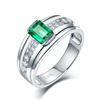 Image 1 : A 14KT WHITE GOLD AND EMERALD & DIAMONDS RING.