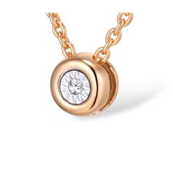 A 14KT TWO-TONE GOLD AND DIAMOND PENDANT.