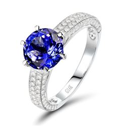 A 14KT WHITE GOLD AND TANZANITE & DIAMONDS RING.
