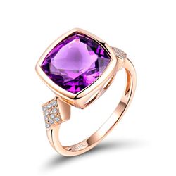 A 14KT ROSE GOLD AND AMETHYST & DIAMONDS RING.