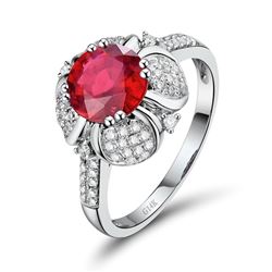 A 14KT WHITE GOLD AND RUBY & DIAMONDS RING.