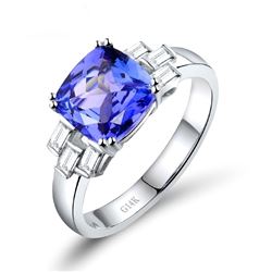 A 14KT WHITE GOLD AND TANZANITE & DIAMONDS RING.