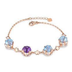 A 14KT ROSE GOLD AND TOPAZ & AMETHYST BRACELET.