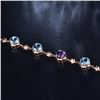 Image 3 : A 14KT ROSE GOLD AND TOPAZ & AMETHYST BRACELET.
