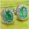 Image 3 : A 14KT WHITE GOLD AND EMERALD & DIAMONDS EARRINGS.