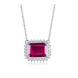 A 14KT WHITE GOLD AND TOURMALINE & DIAMONDS PENDANT.