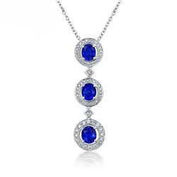 A 14KT WHITE GOLD AND SAPPHIRE & DIAMONDS PENDANT.