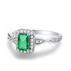 Image 2 : A 18KT WHITE GOLD AND EMERALD & DIAMONDS RING.