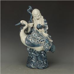 A BLUE & WHITE EASTERN SANTA STATUE QING DYNASTY.