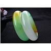 Image 1 : A PAIR NATURAL EMERALD GREEN NEPHRITE JADE BANGLE.