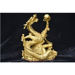 A GILT BRONZE DRAGON PLAY STATUE QING DYNASTY.