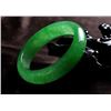 Image 4 : A NATURAL GREEN JADE BANGLE.