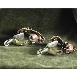 EQUESTRIAN TACK: Crocket and Renalde small silvertone spurs with round 10-notch rowels and tooled le