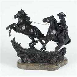 BRONZE:  Elie Hazak's ''Challenge on the Range'' bronze statue depicting a cowboy wrangling a wild h