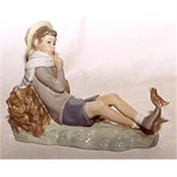 Llardo reclining boy with little bird on foot #1364986