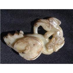 Celadon-green jade carving featuring a fish #1365168