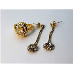 18)  GOLD TONE AND CLEAR CRYSTAL RING,