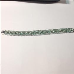 25) STERLING SILVER EMERALD SET BRACELET.