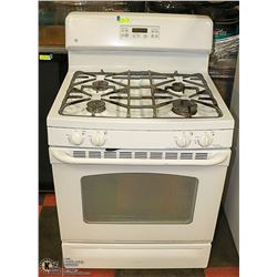 GE PROPANE GAS RANGE WORKING NEEDS CLEANING.