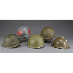4 WWII US HELMETS & 1 WWI FRENCH AIR CORPS HELMET.
