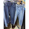 Image 1 : Rack full of women pants and tank tops
