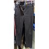 Image 2 : Rack full of women pants and tank tops