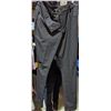 Image 5 : Rack full of women pants and tank tops