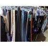 Image 8 : Rack full of women pants and tank tops