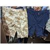 Image 12 : Rack full of men's clothing from the show
