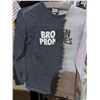 Image 2 : A rack full of men's shirts, T-shirts, and, polos