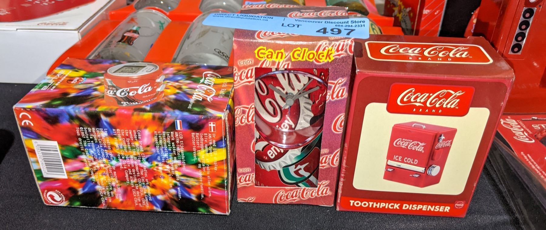 Coca Cola tooth pick dispenser and a clock