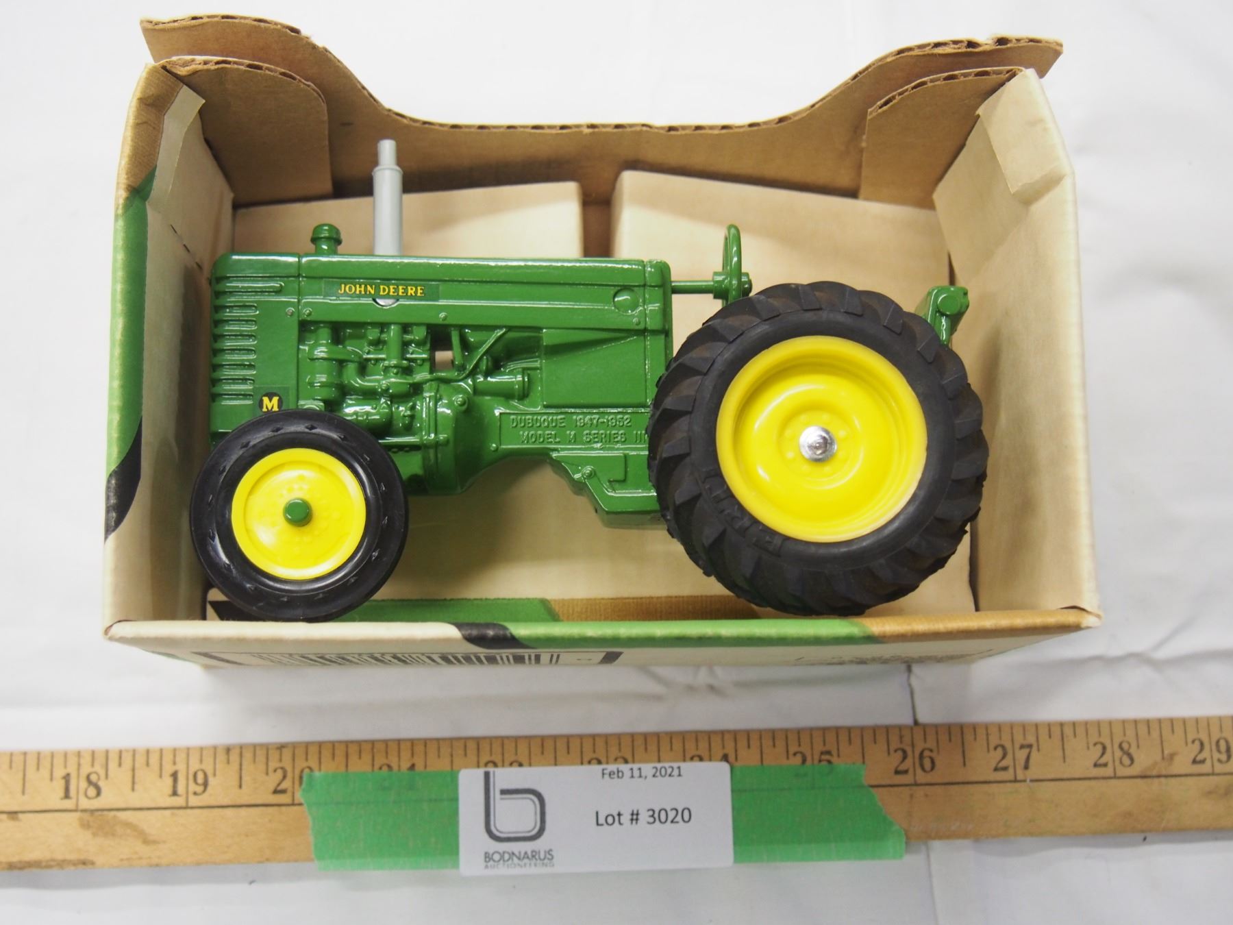 John Deere model M tractor 1/16 scale (NIB) Bodnarus Auctioneering